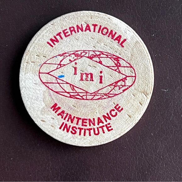 5/$20 Wooden Nickel International Maintenance Institute IMI 1.5" x1/8" Red Ink - Picture 2 of 2